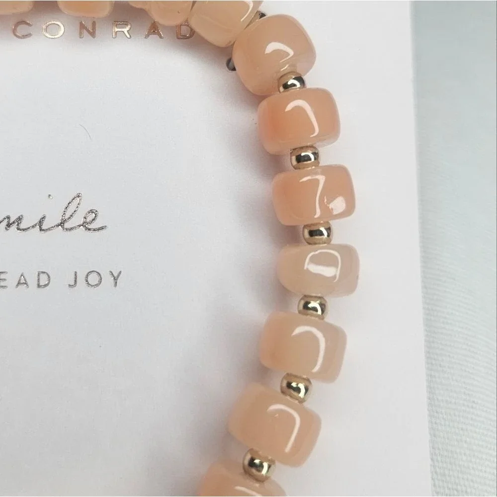 Lauren Conrad Gold Tone Metal And Peach Glass Bead Stretch Smile Bracelet